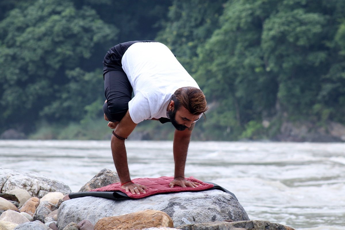 crow pose bakasana ganga river rishikesh