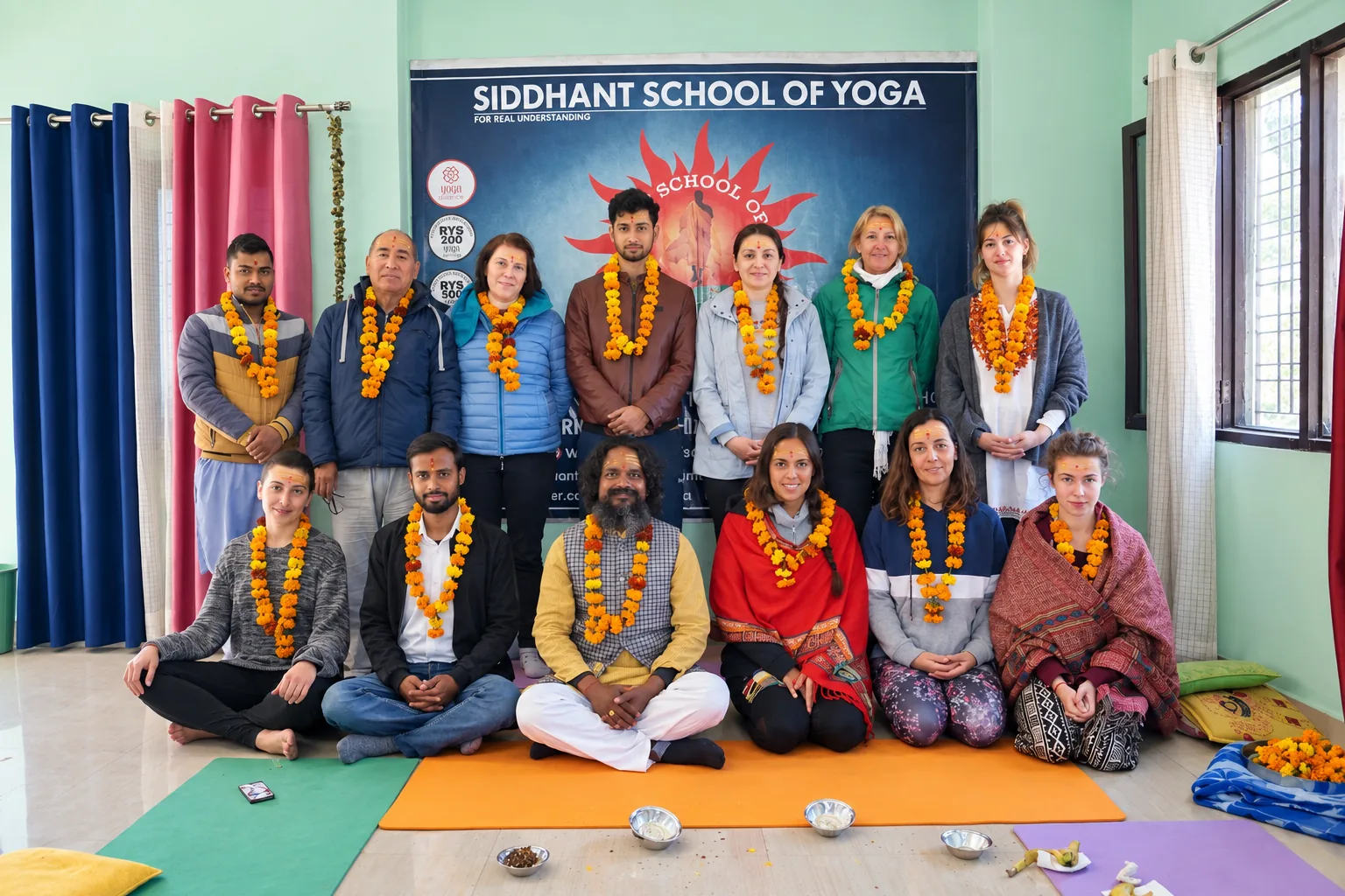Graduating batch of Yoga Alliance certified 200-hour and 500-hour yoga teacher training students in Rishikesh