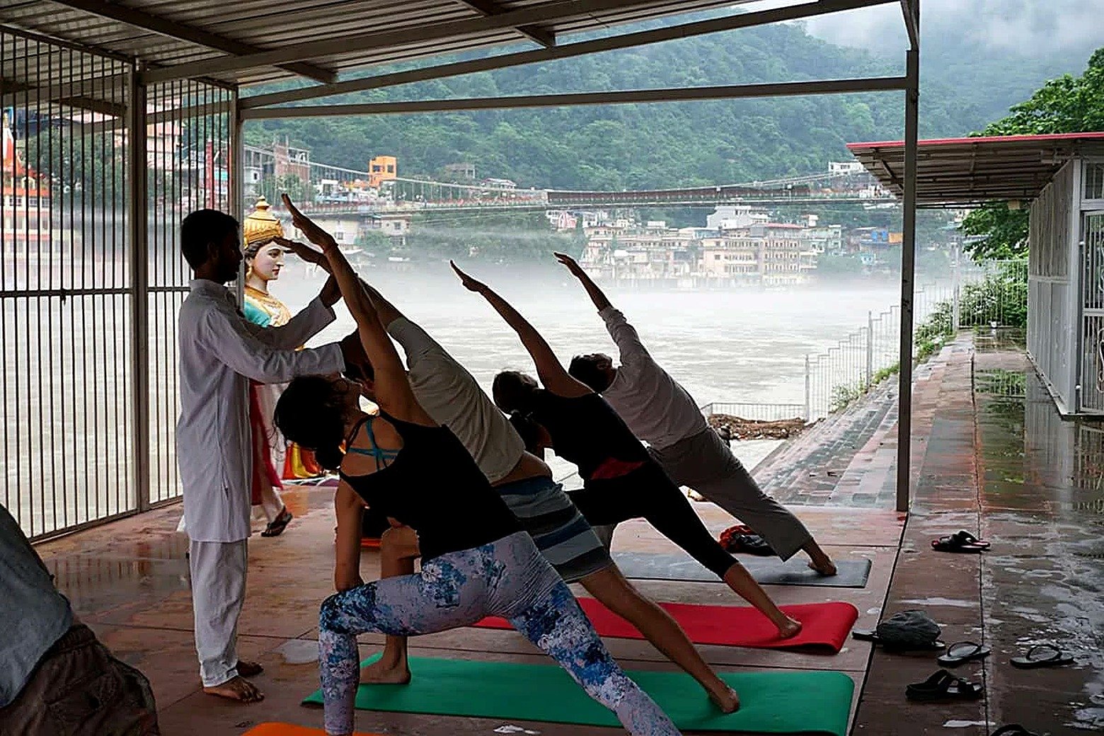 Student practicing side angle pose in a riverside beginners class