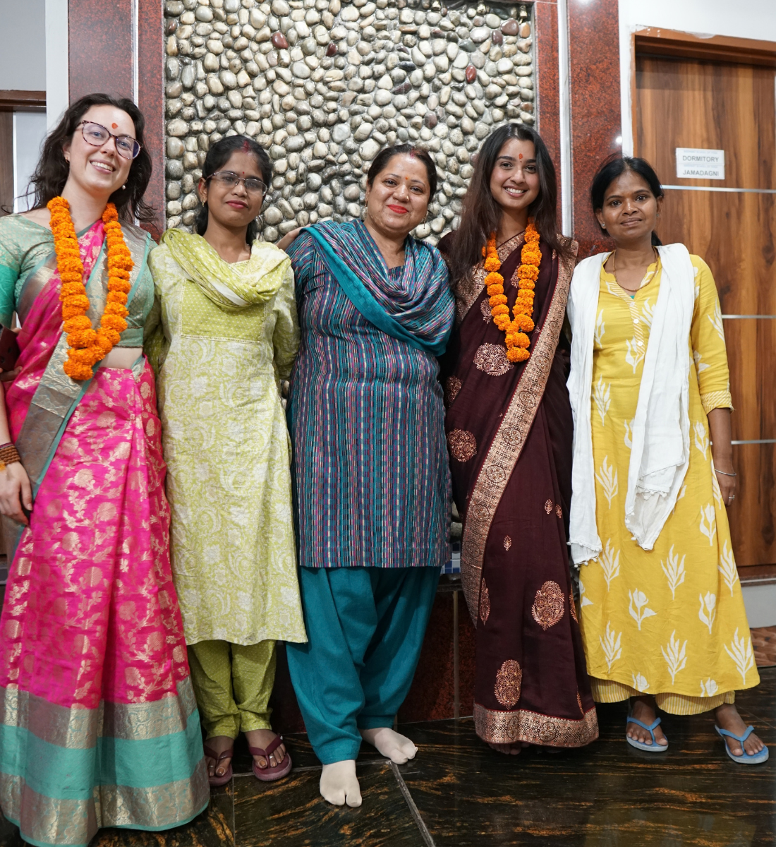 Future yoga teachers celebrating their graduation ceremony in Rishikesh