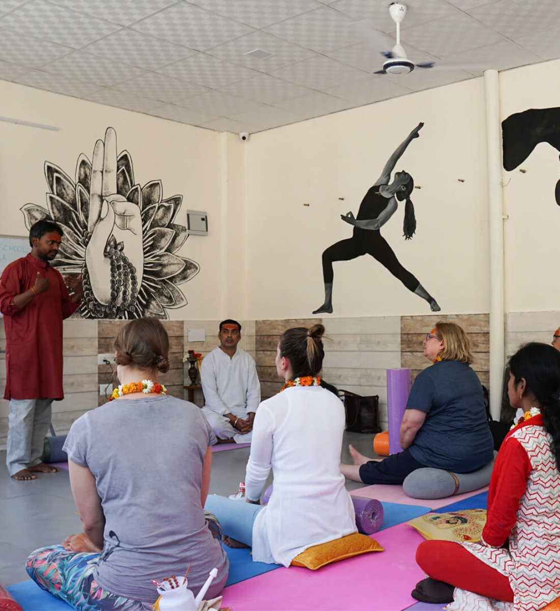 Teacher and students in a satsang-style philosophy class